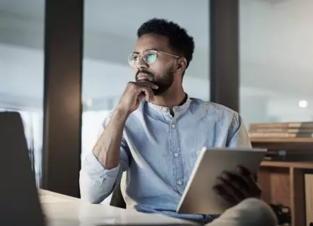 man is holding the tablet